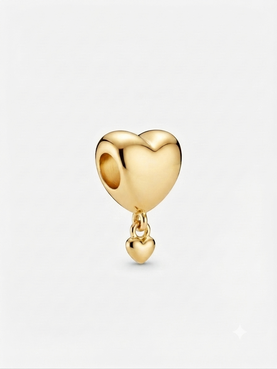 Gold-tone double heart dangle charm on a white background