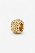 Gold-tone wheat-pattern spacer charm with clear crystals on a white background