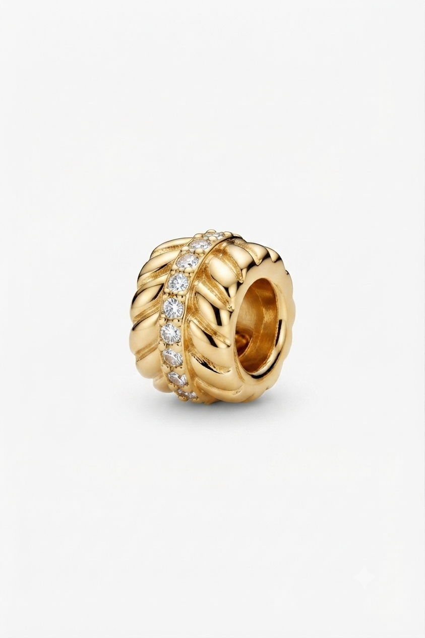 Gold-tone wheat-pattern spacer charm with clear crystals on a white background