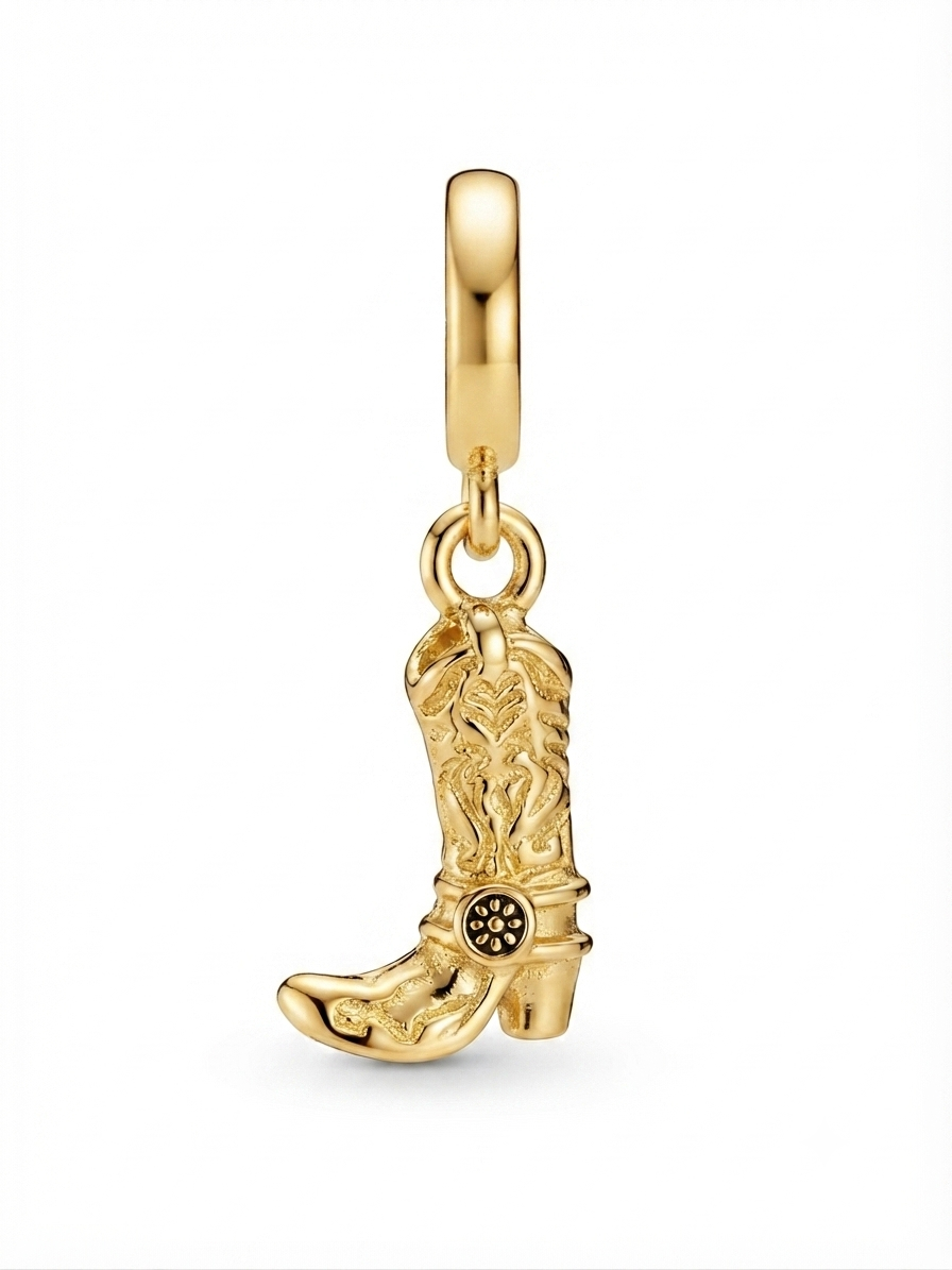 Gold-tone western cowboy boot charm on a white background