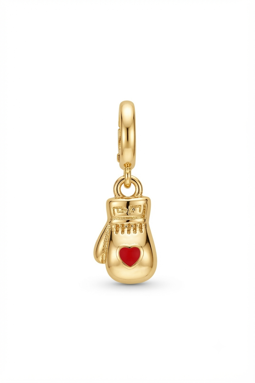 Gold-tone boxing glove charm with a red heart on a white background