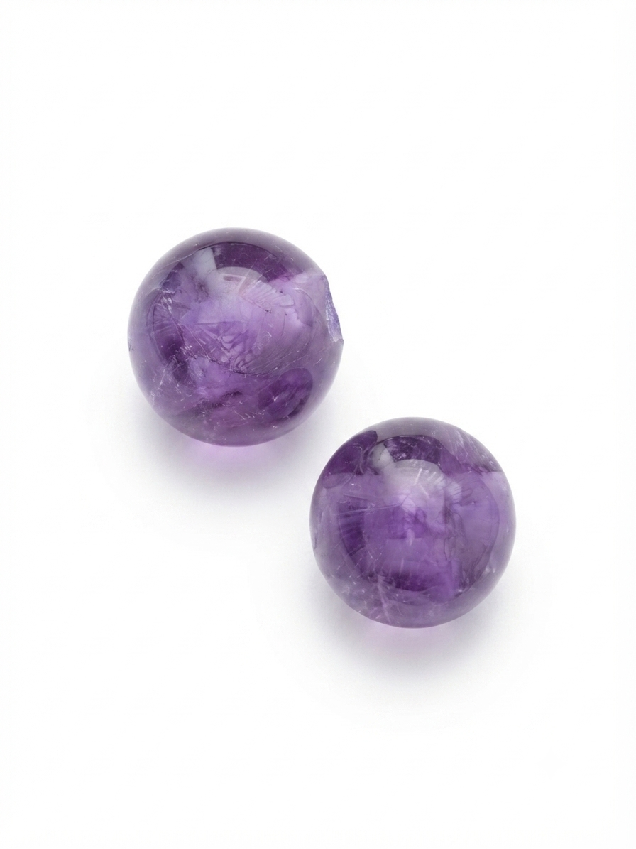 Purple amethyst round crystal beads on a white background