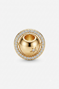Gold-tone round halo charm with clear crystals and a star detail
