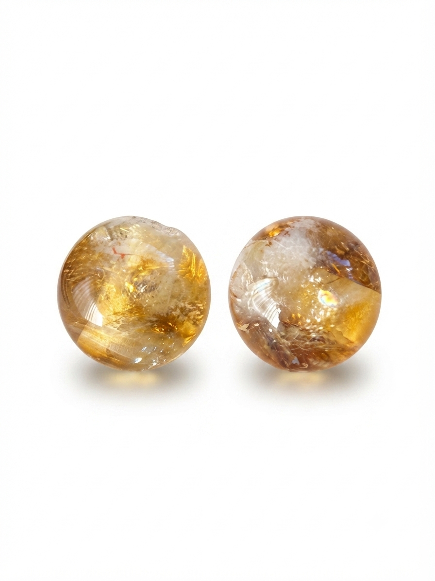 Golden inclusion quartz round beads on a white background