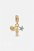 Gold-tone seashell, seahorse and turquoise starfish charm