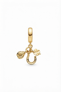 Gold-tone ladybird, horseshoe and clover dangle charm on a white background